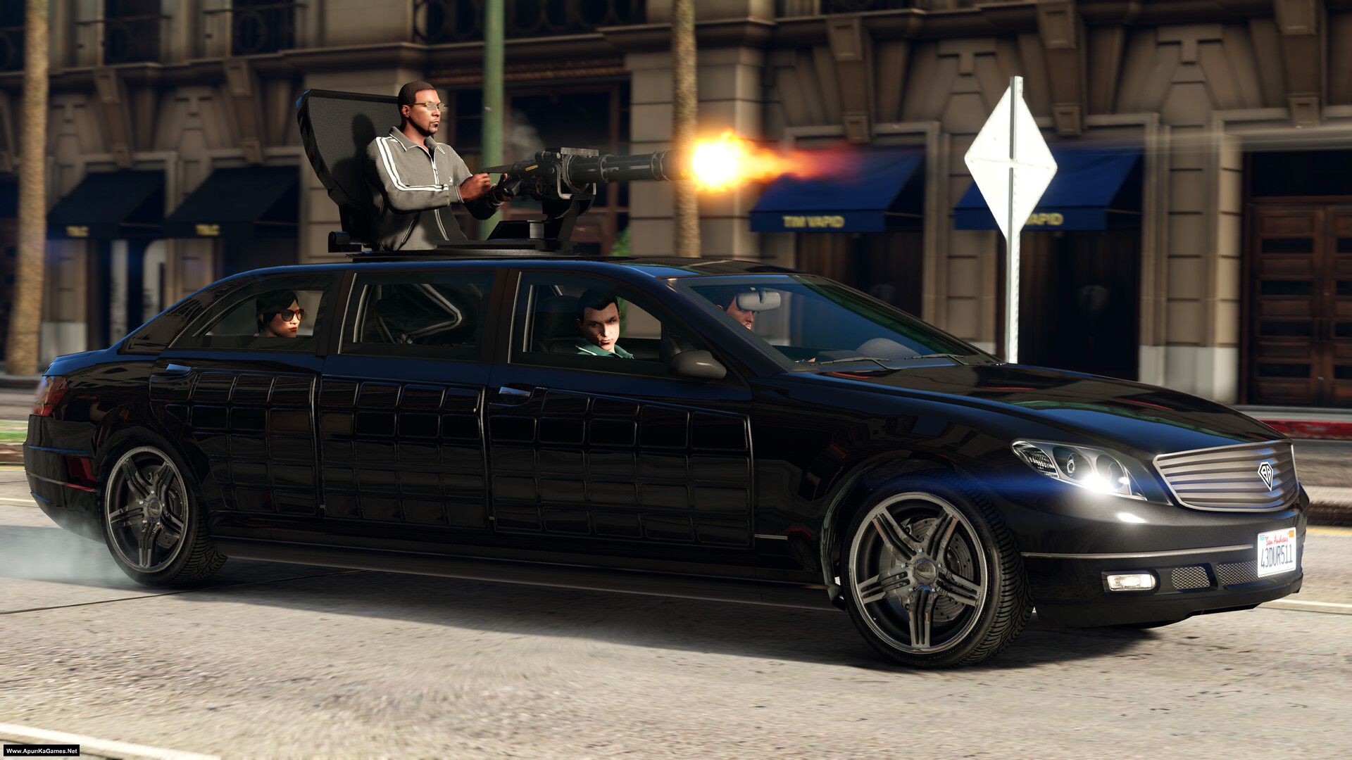GTA 5 Enhanced (Grand Theft Auto V Enhanced Edition) Game for PC Highly Compressed Full A black luxury sedan with a mounted heavy machine gun firing, featuring a driver and passengers inside. The scene takes place on an urban street with buildings in the background, including one with blue awnings and another with a sign that reads "TIM WAPDO." The car has a California license plate reading "430URS11," and there is smoke coming from its rear tires.